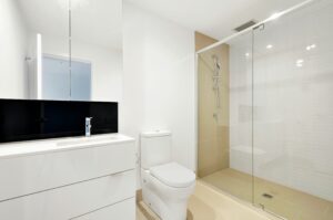 A bright and modern bathroom with a stylish Walk-In Shower in the background.